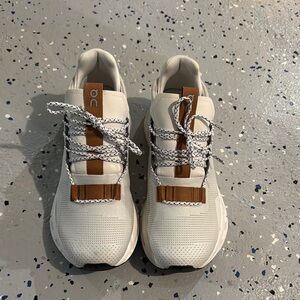 On Running White and Brown Sneakers with Athletic-Casual Style